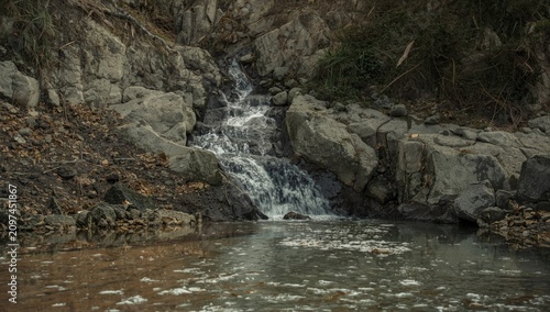 Small Waterfall Flowing Ove...