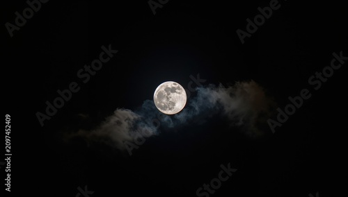 Full Moon Surrounded by Clo...