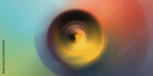 фотографія Soft teal and yellow radial motion blur with dark central focal point