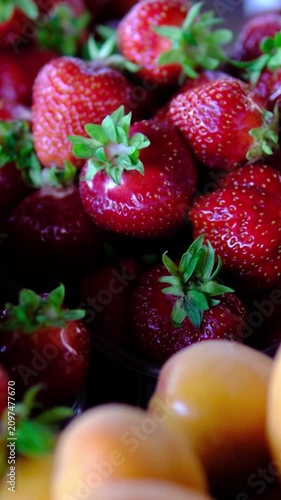 Complete step by step strawberry preparation for freezing, from washing and hulling to slicing, blending and portioning into containers for long term storage