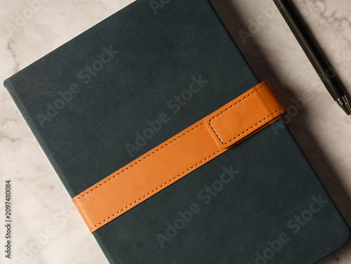 Tableau sur toile Synthetic leather planners with a strap closure
