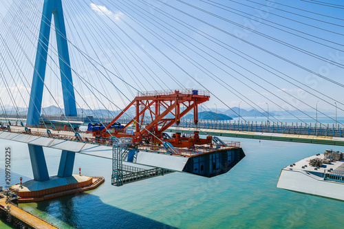 Canvas-taulu Bridge girder launcher crane installing a steel segment on a cable-stayed bridge
