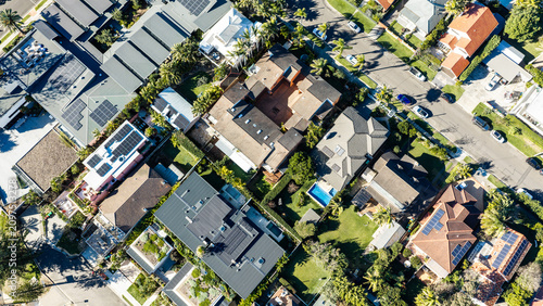 Top-Down Aerial View of Residential Homes with Rooftop Solar Panels in Sydney