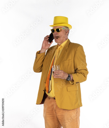Photography Businessman man with cigar in yellow suit isolated on white background