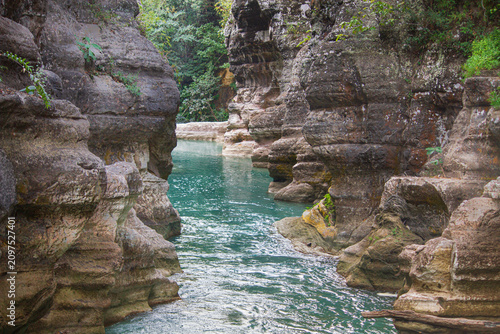Amazingly, in East Sumba which has a long dry season and hard, rocky, coral-like soil—there are still waterfalls, cutting through the stone mountains and absolutely beautiful