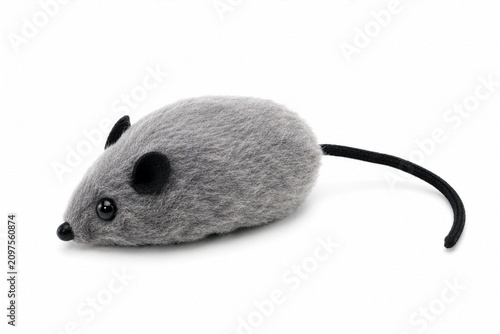 Grey fuzzy mouse cat toy with black tail isolated on white background, soft pet accessory and playful animal toy cut out for design resources