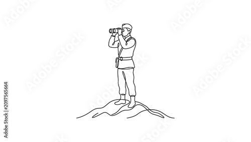 Man standing on mountain peak looking.