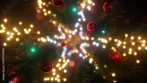 Blurred Festive Christmas Tree with Glowing Warm Bokeh Lights and Red Ornaments for Holiday Celebration