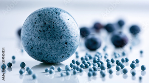 Textured Blue Spheres and Small Balls on Reflective Surface