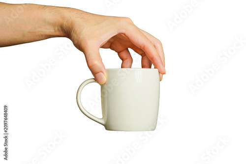 man's hand holding a white ceramic coffee cup against a white background.
