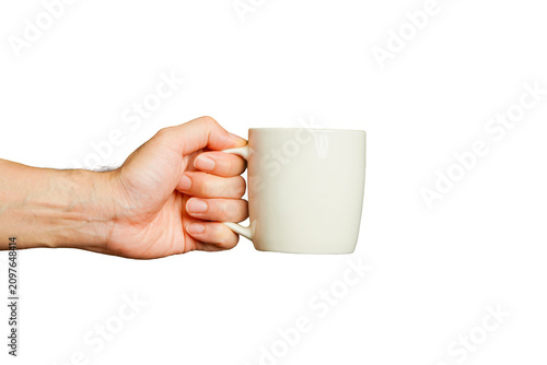 man's hand holding a white ceramic coffee cup against a white background.