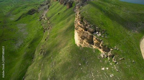 Aerial view of a mountain plateau with high cliffs. Landscape and nature of the North Caucasus.