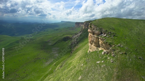 Aerial view of a mountain plateau with high cliffs. Landscape and nature of the North Caucasus.