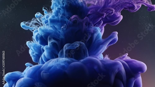 Clouds of blue and purple ink mix in water to create colorful swirls and patterns
