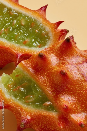 Kiwano Horned Melon Whole Orange Spiky Exterior Studio Macro Portrait Vertical