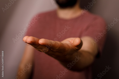 Person's open palm extended...
