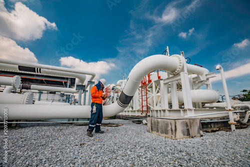 Male worker inspection at valve of visual check record pipeline oil