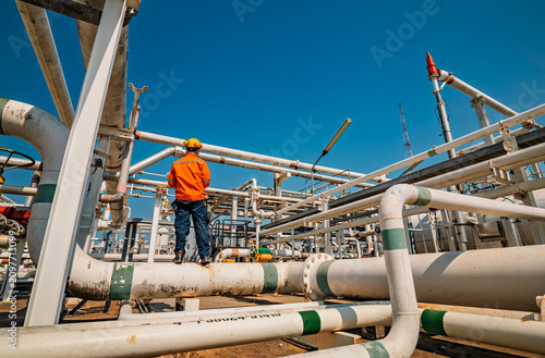 Male worker inspection at valve of visual check record pipeline oil