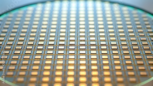 Silicon wafer disc with many microchips and integrated circuits for semiconductor
