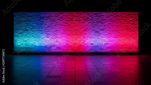 Fotografía Rectangular brick wall illuminated with vibrant blue, purple, and red neon spotl