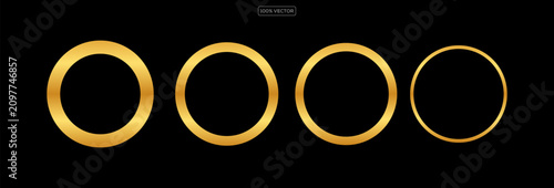 Cuadro en lienzo gold  rings glow softly against a stark black background