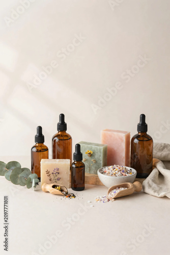 Premium Flat Lay of Natural Herbal Skincare Products with Botanical Soaps, Amber Serum Bottles, Bath Salts, and Fresh Greenery on Soft Pastel Background for Clean Beauty and Wellness Branding