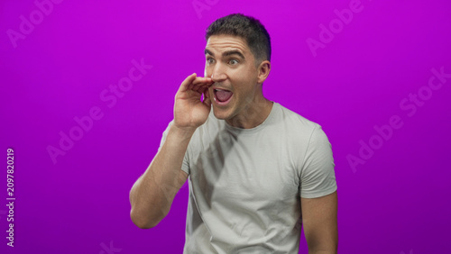Canvastavla Man shouting with hand to mouth and animated hand gestures in purple studio setting, wearing white t shirt; enthusiasm persuasion communication