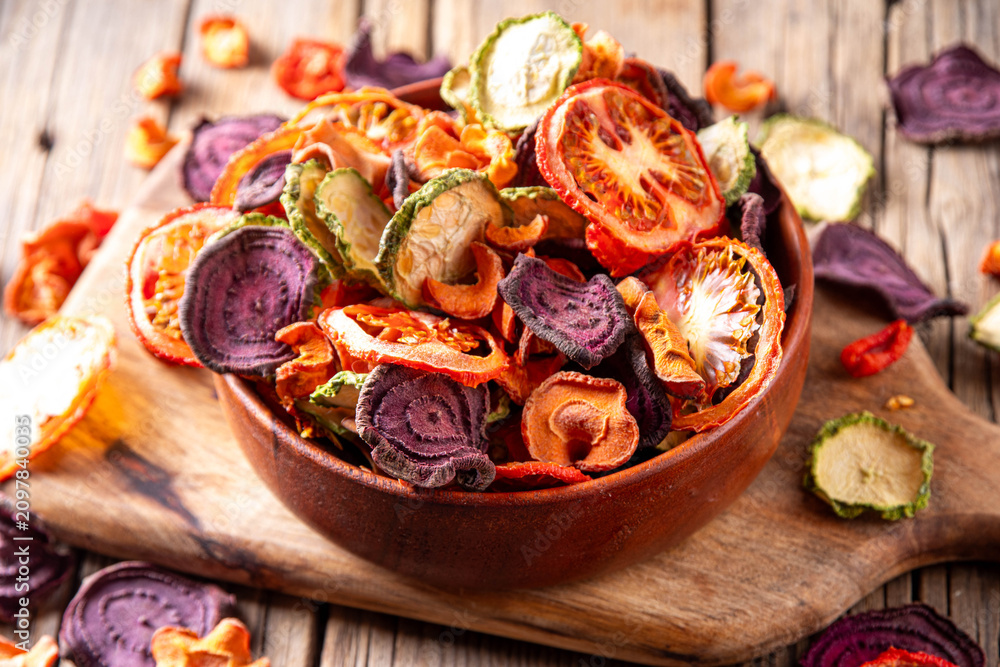 Fototapeta premium Healthy alternative for traditional potato chips, snack dry vegetables chips, raw organic dehydrated veggies - beets, carrots, zucchini, kale, tomatoes, 