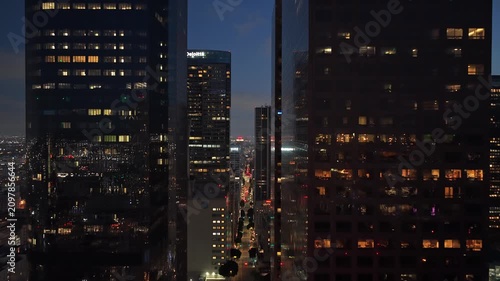 Towering skyscrapers and modern glass buildings in Los Angeles downtown illuminating streets at twilight. Cityscape featuring urban metropolis in California, America. 02,02,2026, Los Angeles, USA, 