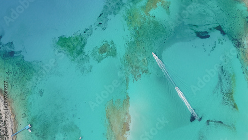 Konstfotografi Top down drone view of two speedboats leaving white foam trails on crystal clear