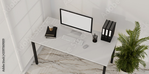 Top view a computer displaying a simulated white screen, set within a white office environment, 3D Render