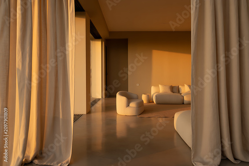 Elegant living room with curtains and warm golden hour light, interior