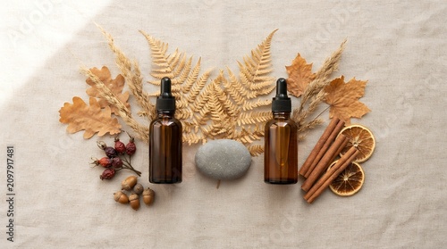 Autumn arrangement with bottles and spices on linen