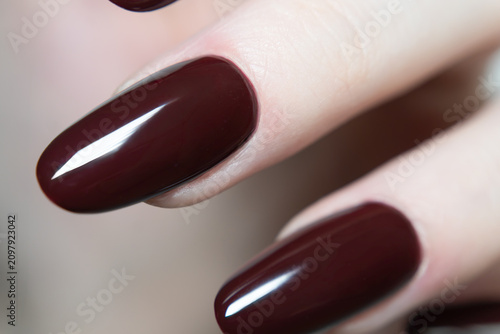 Fotografía Dark burgundy almond manicure macro, glossy gel nail polish, luxury beauty treat