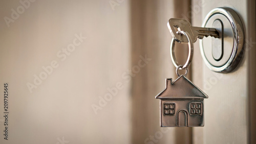 House Key with Home Keychain for Real Estate and Home Ownership Concept
