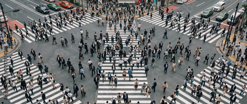 Crowded pedestrian crossing in a bustling city intersection