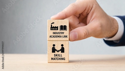 Hand holding wooden blocks with industry academia link and skill matching  business concept