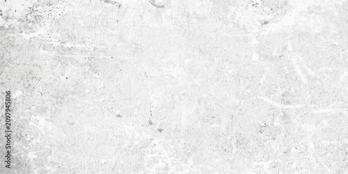 Photos A textured light gray concrete wall with subtle imperfections and marks, suggesting a weathered urban or industrial surface, perfect for background or grunge design elements
