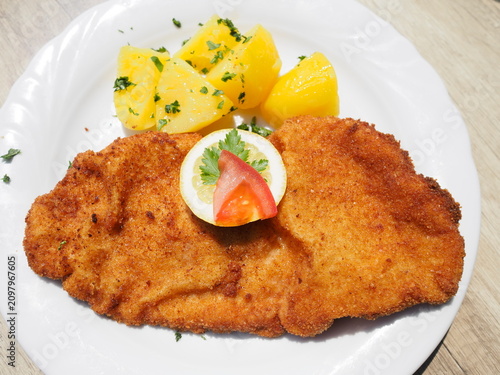 Vienna - Austria - breaded Wiener Schnitzel with potatoes and lemon slice