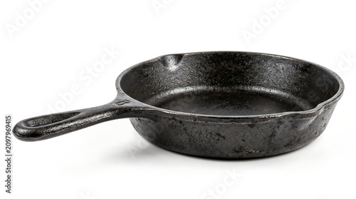 A well-seasoned, dark cast iron skillet with a handle, ready for cooking, isolated on a clean white background.
