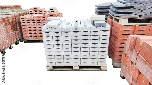 Canvas Print Stacked concrete curbstones on pallets.