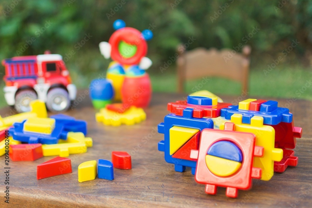 Obraz premium Colorful Outdoor Toy Blocks and Vehicles for Kids.