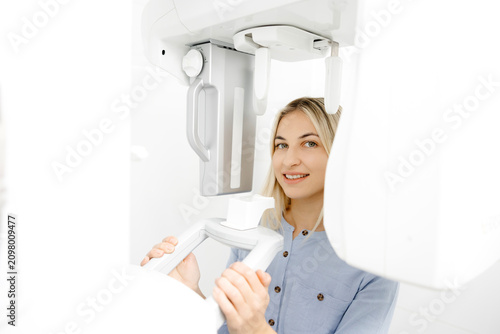 Young woman undergoing a dental panoramic radiography exam