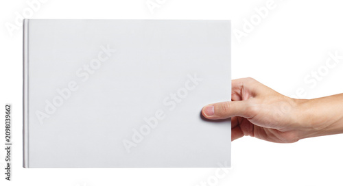 Konstfotografi Hand holding wide hardcover book with blank white cover, isolated on transparent