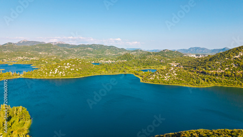 Fotografie Aerial view of Bacina Lakes in Dalmatia, Croatia, featuring blue water, green hi