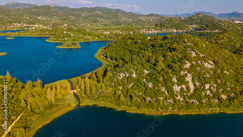 Konstfotografi Aerial view of Bacina Lakes in Dalmatia, Croatia, featuring lush green hills, de
