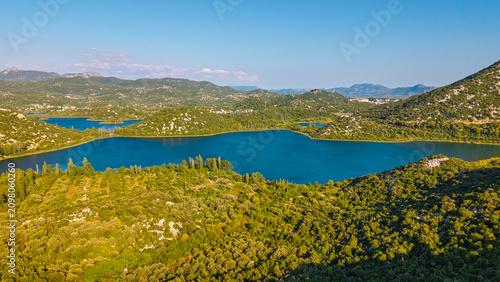 Fotografie Aerial view of Bacina Lakes in Dalmatia, Croatia, featuring blue water surrounde