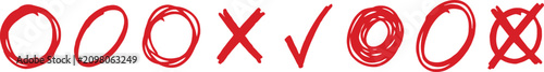 Teacher's grading, red pen circles, crosses, and checkmarks