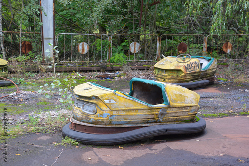 Fotografie Bumper cars in Ghost City of Pripyat exclusion Zone of Chernobyl accident domina