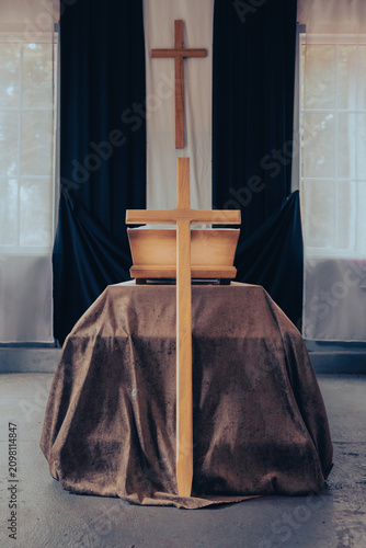 Fotografie Wooden coffin and cross arranged for Christian funeral service